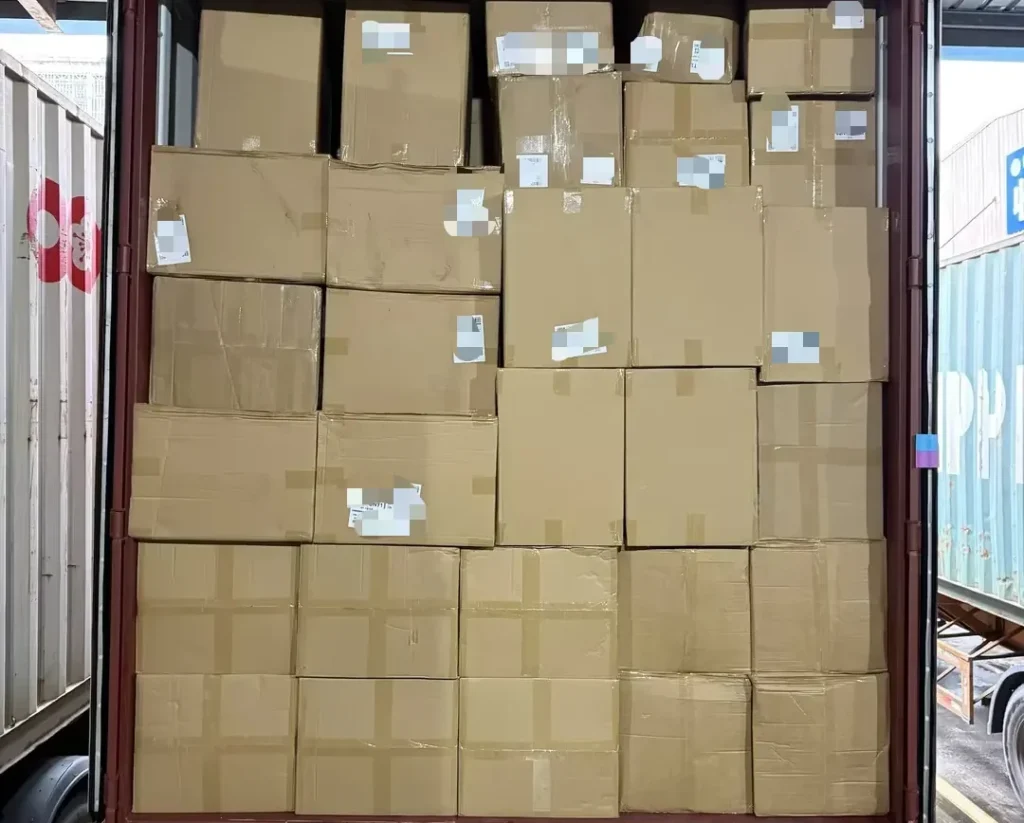 Cartons of guitars loaded inside a shipping container for DDP sea freight from Shenzhen to the USA.
